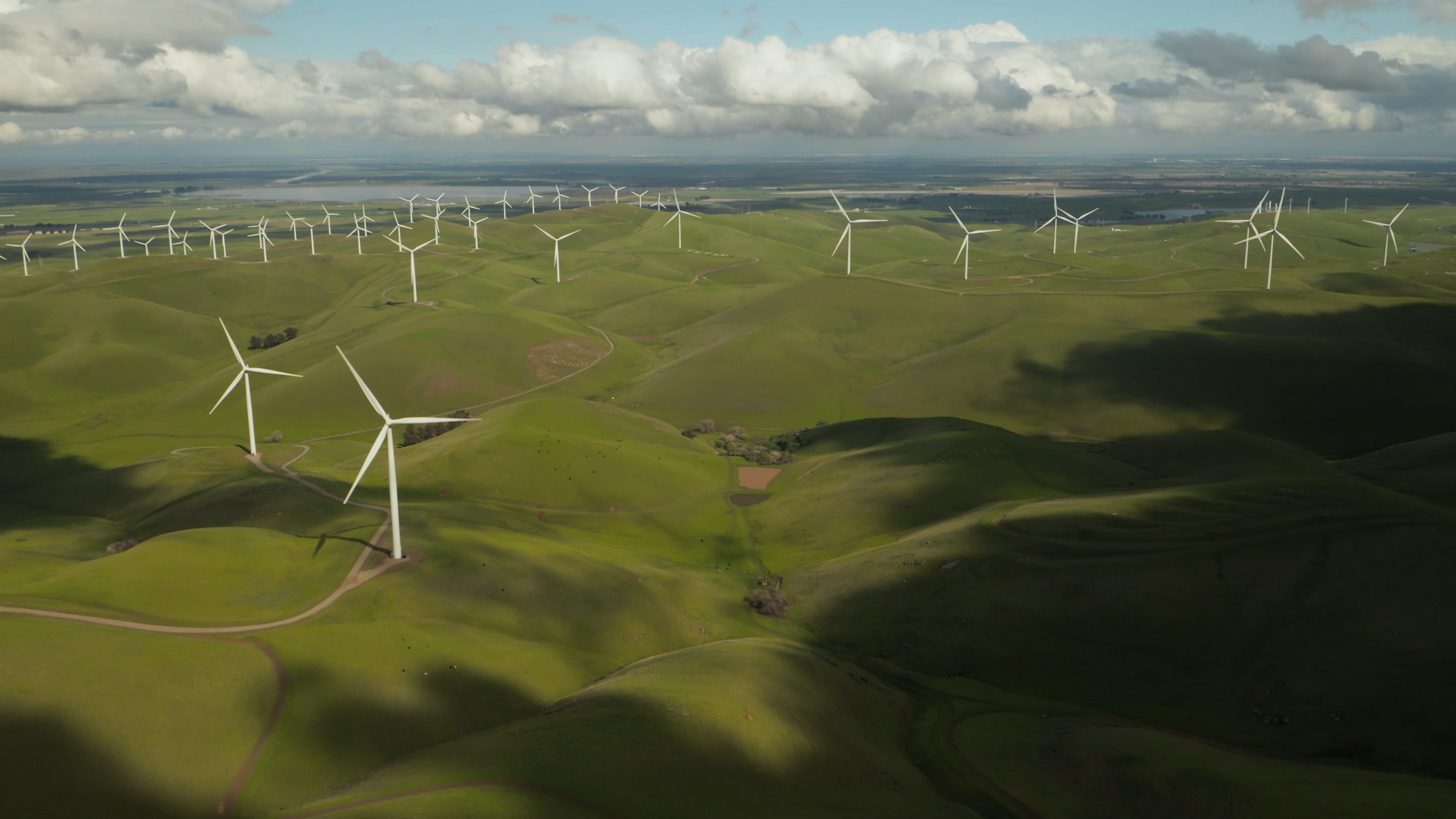 aerial view of windmills on hills