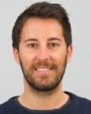 Daniel in a blue shirt, white background