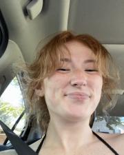 Gracie smiling in a black shirt.