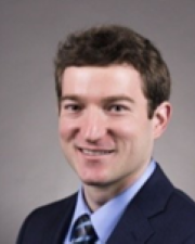 James in a suit headshot 