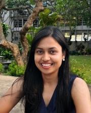 Komal smiling outside