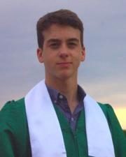 Shane in green graduation gown